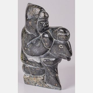 Inuit Black Stone Carving Depicting a Seal Hunter