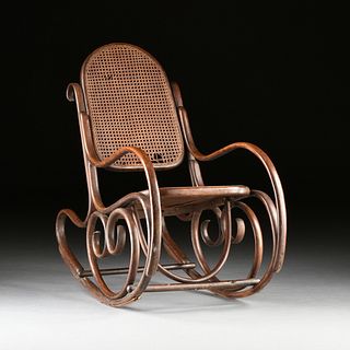 A THONET STYLE CANED AND BENTWOOD ROCKING CHAIR, EARLY 20TH CENTURY,