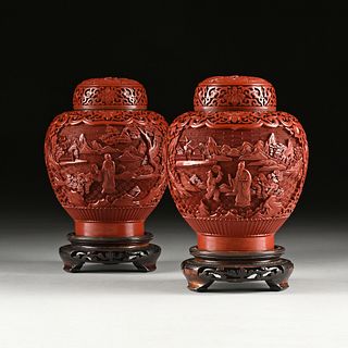 A PAIR OF CHINESE CARVED CINNABAR LACQUER FIGURES IN LANDSCAPE LIDDED JARS, 20TH CENTURY,