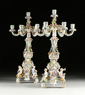 A PAIR OF MEISSEN FLORAL ENCRUSTED AND FIGURAL PORCELAIN SEVEN-LIGHT CANDELABRAS, MARKED, LATE 19TH/EARLY 20TH CENTURY,
