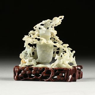 A CHINESE CELADON JADE COVERED VASE ON STAND, MOONLIT HUNTERS WITH FAWN, DOG, AND PHOENIX GROUP, POSSIBLY QING DYNASTY (1644-1912),