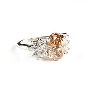 A PLATINUM, COGNAC, AND WHITE DIAMOND COCKTAIL RING,