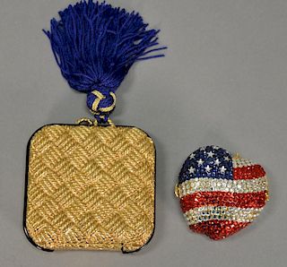 Two compacts including Isabel Canovas compact (lg. 3") and an Estee Lauder Lucidity American flag compact (lg. 2").