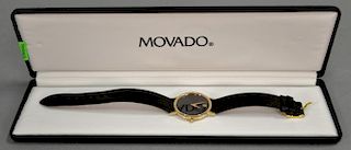 Movado wristwatch with leather band.