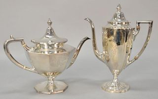 Two sterling silver tea pots including Marshall Field & Co. sterling two pint teapot (ht. 8") and a tall tea pot (ht. 10"), 31.5 t oz.