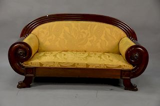 Danish Empire mahogany sofa with rounded arms and back on claw feet.