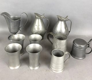 A Group of Pewter Pitchers, Steins and Cups