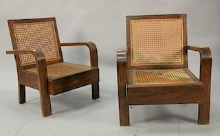 Pair of oak caned seat armchairs.
