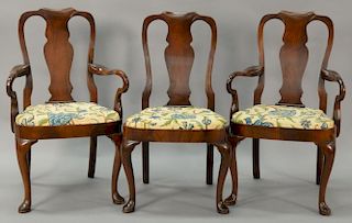 Set of ten mahogany Queen Anne style chairs with crewelwork seats.
