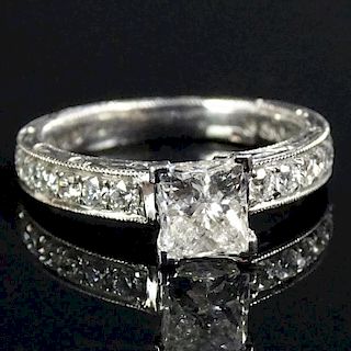 AIG Certified 1.39 Carat Diamond and 18 Karat White Gold Engagement Ring set in the center with a .85 Carat Princess Cut Diamond and accented througho