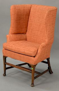 Custom English style wing back chair with stretcher base.