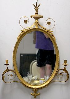 Gilt oval Federal style mirror. ht. 41 in.; wd. 29 in.