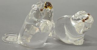 Two crystal Steuben baby beavers with garnet eyes signed Steuben, ht. 3 1/2" and 2 1/2".