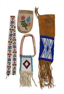 A group of Native American beaded hide items