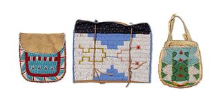 A group of Native American beaded hide bags