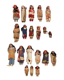 A large collection of Skookum dolls