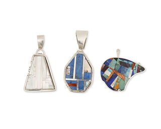 A group of Southwest sterling and stone set pendants