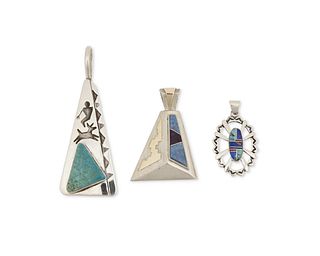 A group of Southwest style sterling and stone set pendants