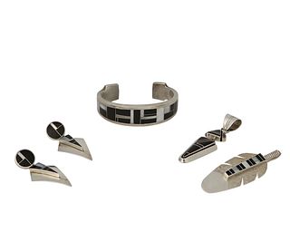 A mixed group of Native American silver inlay jewelry