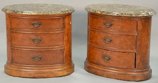 Pair of Ernest Hemingway Collection contemporary marble top bedside stands, oval form. ht. 30", top: 22" x 32".
