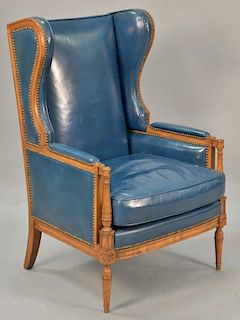 Blue leather wing chair.