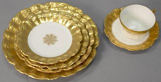 Large Limoges porcelain dinner set with thick gold border, 110 pieces.