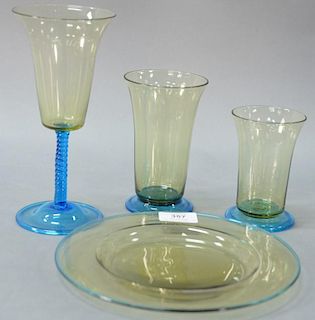 Thirteen Steuben celeste blue and amber plates (dia. 8 1/2") along with a set of near matching Venetian glasses in three sizes...