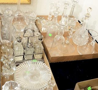 Four box lots of crystal and pressed glass decanters, candlesticks, and stems.