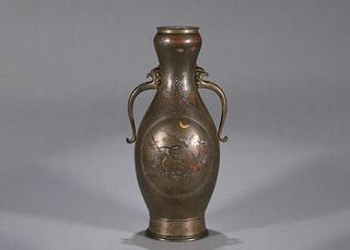 A bronze vase with phoenix shaped ears