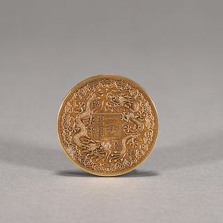 A dragon patterned gold coin