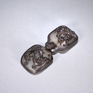 A chi dragon patterned jade button