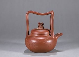 A loop-handled Yixing clay pot