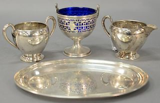 Four sterling silver pieces including creamer, sugar, small tray, and a small basket with cobalt liner. 12.3 t oz.