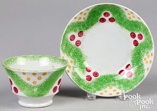 Green spatter cup and saucer with Christmas balls.
