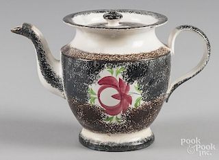 Black and brown rainbow spatter teapot with Adams rose decoration, 7'' h.