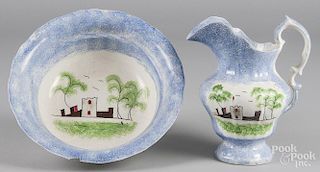 Blue spatter pitcher and basin with fort decoration, 10 1/4'' h. and 4 1/2'' h., 12 1/4'' dia.
