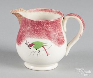 Red spatter creamer with parrot decoration, 4'' h.