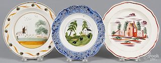 Three English creamware and pearlware plates, 19th c., with house decoration, 7 5/8'' dia.