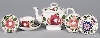 Rose decorated Staffordshire, 19th c., to include a teapot, 6 1/4'' h., a cup and a saucer