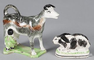 Spatter cow creamer, 20th c., 5 1/4'' h., together with a Staffordshire rabbit, 2 1/2'' h.