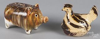 Two pottery still banks of a hen, 3 1/2'' h., and a pig, 3 1/4'' h.