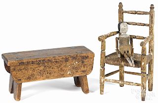 Early stick leg doll, together with a doll chair and a pine stool.