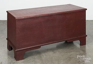 Painted pine blanket chest, 19th c., retaining an old red surface, 25'' h., 48'' w.