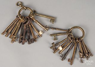 Two rings of early brass and iron keys, 18th/19th c.