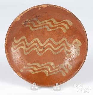 Pennsylvania redware pie plate, 19th c., with yellow slip decoration, 8 1/8'' dia.