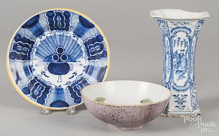 Delft items, 18th c., to include a plate, 8 7/8'' dia., a bowl, 2 3/4'' h., 7 1/2'' dia., and a vase