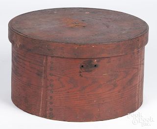 Pine and Oak bentwood pantry box, 19th c., retaining its original red surface, 6 3/8'' h., 11 1/2'' w.