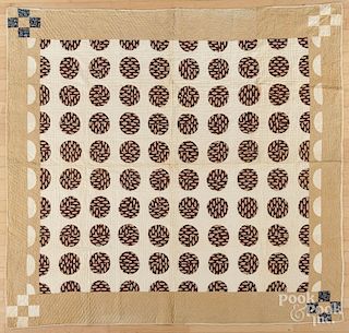 Hand pieced drunkard's path pattern quilt with nine-patch corner posts, late 19th c., 73" x 76".