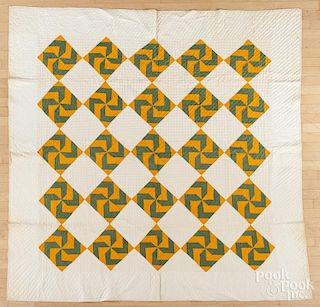 Pieced pinwheel in diamond quilt, late 19th c., 79'' x 80''.