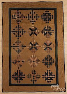 Pieced diamond in block quilt, early 20th c., 62'' x 92''.